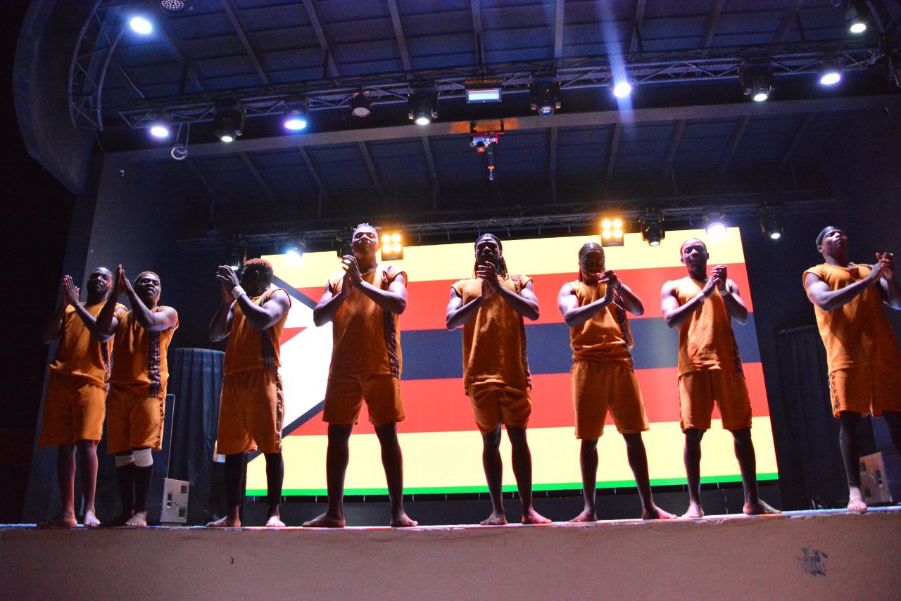 Acrobats performing aerial stunt